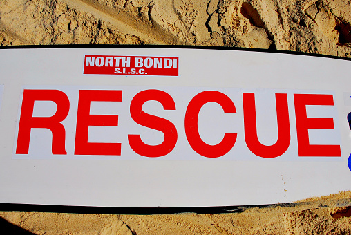 North Bondi Beach, New South Wales, Australia - April 8, 2007: A “SURF RESCUE” surfboard used by the North Bondi Surf Life Saving Club lies on North Bondi Beach awaiting use in an emergency.