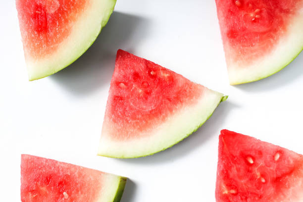 istock red watermelon pieces arranged, on white background 1474283519