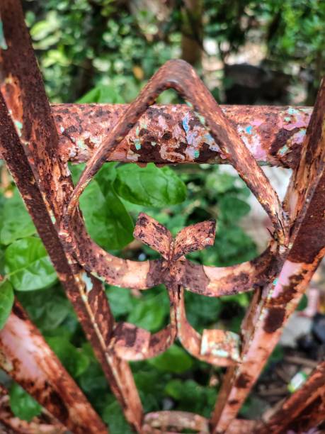 istock an old rusty fence with age in an uninhabited house 1474288256
