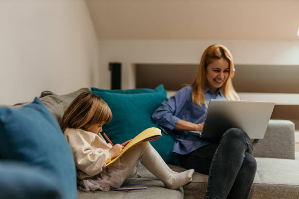istock Mom is working, daughter is drawing 1474289187