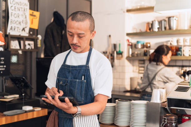 istock Barista check stock by tablet 1474289447
