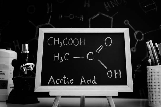 acetic acid and symbol structural formula chemical on the blackboard