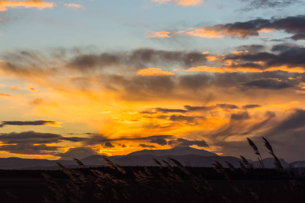istock colorful clouds at the sky during sundown in a flat landscape 1474291256