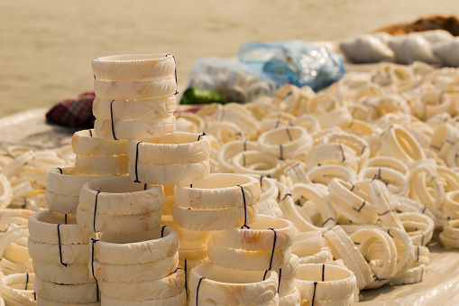 shankha or white bangles made of conch shells being sold near sea beach of digha. These bangles are traditional attire for married bengali women