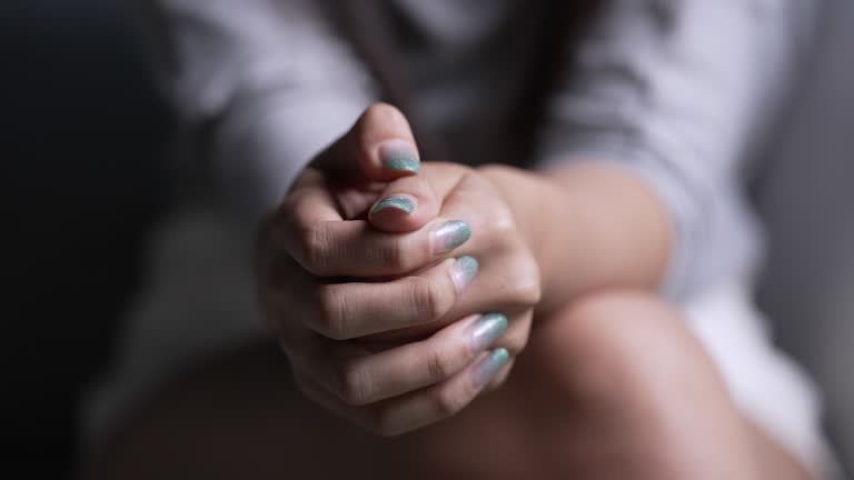 Close up shot of young woman's hand with Mental Health issue.