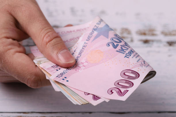 Young man holding Turkish banknotes. Turkish Lira TRY or TL stock photo