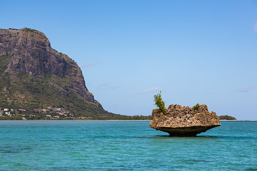 Crystal Rock, an exposed fossilized coral reef formation situated off the south-west coast of Mauritius, close to the Le Morne mountain