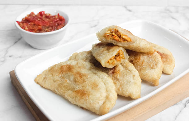 Cireng filled with spicy chicken, a delicious Bandung specialty Cireng filled with spicy chicken, a delicious Bandung specialty. Cireng is made from tapioca flour which is seasoned and then filled with minced chicken and then fried gorengan stock pictures, royalty-free photos & images