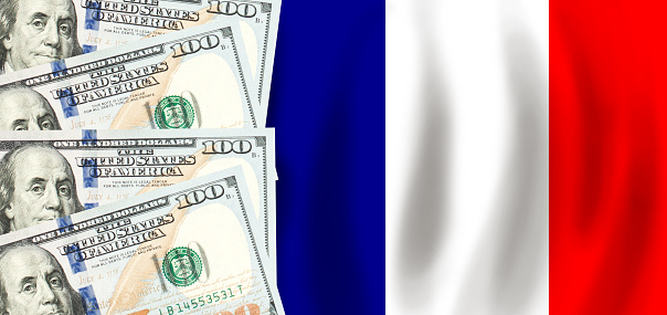 Dollars on flag of France, French finance, subsidies, social support, GDP concept