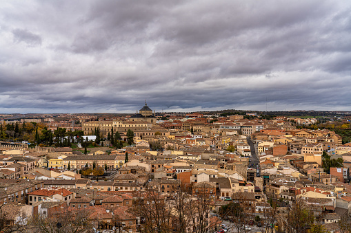 Toledo, Spain - Dec 01, 2022: View of the old city from the Alcazar, Royal Palace over the Tagus River sinuosity. Spain, Europe