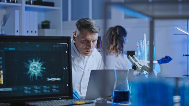 istock Biological laboratory scientist studying experiment results on laptop, research 1474299382