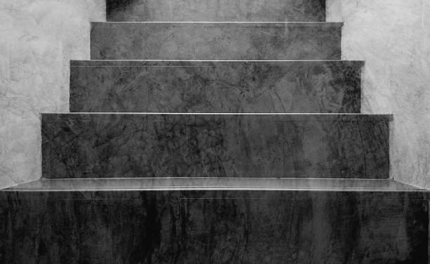 istock Gray polished concrete steps, loft stairway texture for the background. 1474300501
