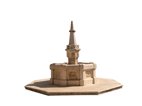 Holy water chirch concrete fountain monument with high spire on octagonal pedestral isolated on white