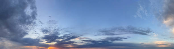 istock Cloudy sky, cloud and orange sun light. Environment good weather panorama 1474302641