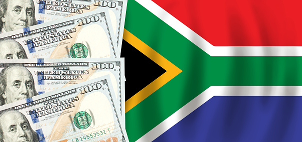 Dollars on flag of South Africa, South African finance, subsidies, social support, GDP concept
