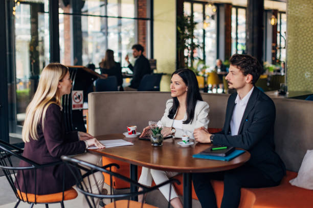 istock Two entrepreneurs are interviewing a new female job candidate 1474311599