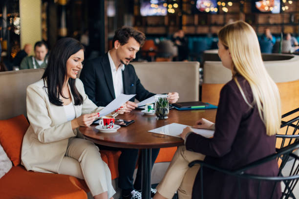 istock Two entrepreneurs interview a candidate and read her CV 1474311661