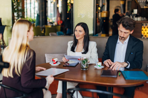 istock Two entrepreneurs conduct a job interview with confident female candidate 1474311706