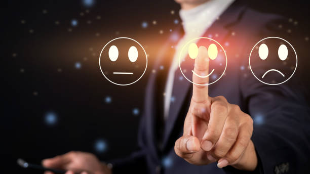 istock Customer Service and feedback concept. Businessman touching virtual screen on happy smile icon 1474312045