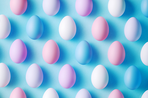 Easter eggs on blue background. Horizontal composition with copy space. Easter concept.