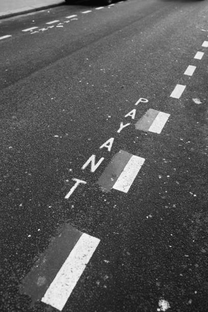 istock Road markings with white paint on asphalt 1474319403