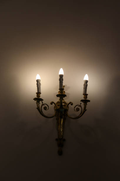 istock Old Vintage Styled Three Wall Candles with Modern Electricity Supplied Power 1474320525