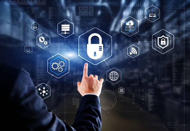 istock Businessman presses cybersecurity button on virtual screens 1474322133
