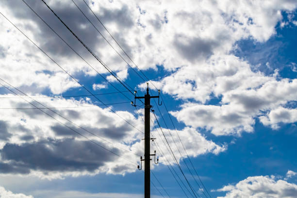 istock Power electric pole with line wire on colored background close up 1474326081