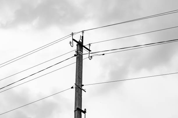 istock Power electric pole with line wire on light background close up 1474326169