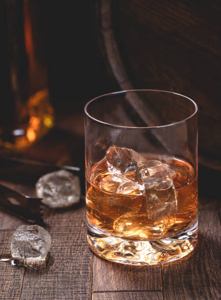 istock Glass of whiskey with ice 1474327855