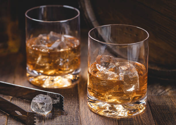 istock Glass of whiskey with ice 1474327885