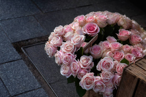 Bunch of roses on a sidewalk