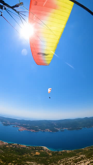 Aerial exploration of coastal vistas and islands with paraglider