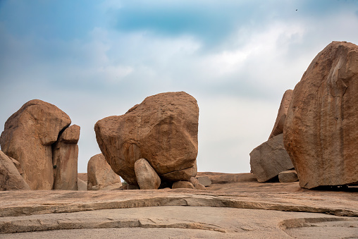 Beautiful view of boulder strewn landcape and ruins at Hampi. Hampi, the capital of Vijayanagar Empire is a UNESCO World Heritage site.