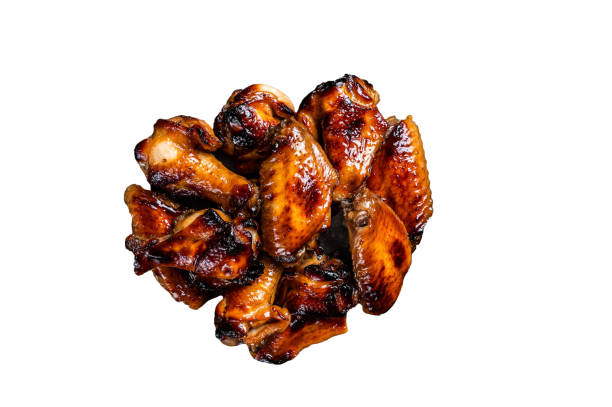 istock BBQ chicken wings in dip Barbecue sauce.  Isolated on white background. 1474330500