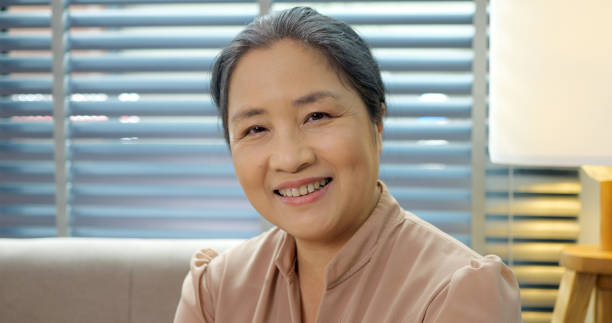 istock Smiling middle aged mature woman looking at camera 1474331446