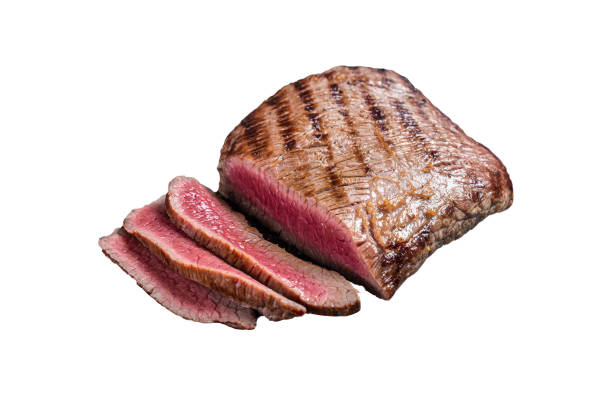 istock Grilled Flank Steak BBQ on a marble board.  Isolated on white background 1474334894