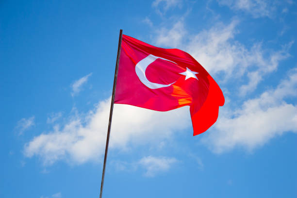 istock Turkish flag on the blue sky background 1474335184