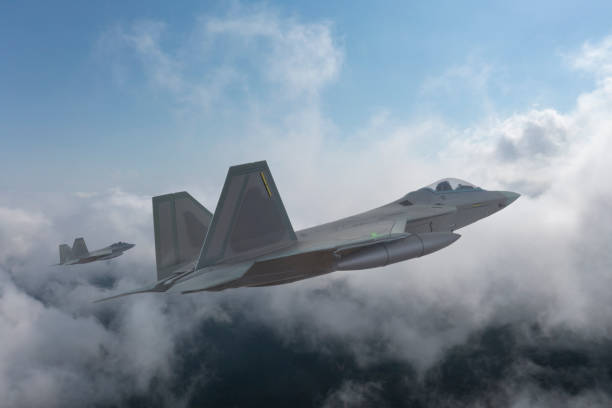 istock Jet aircrafts flying over the clouds. 1474335866