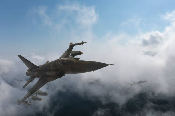 istock Jet aircrafts flying over the clouds. 1474336795