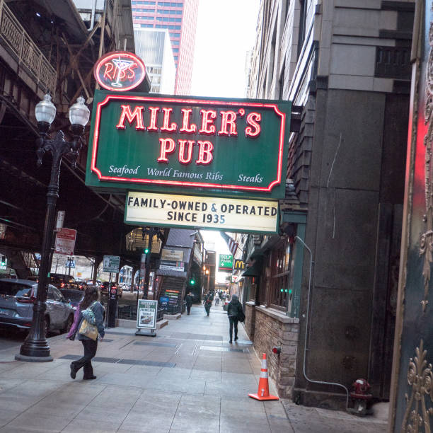 Red, lighted neon sign of Miller's Pub,Chicago, early evening. stock photo