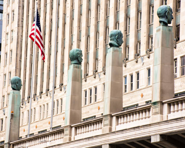View of four busts at Merchant Mart, Chicago, from Chicago River stock photo