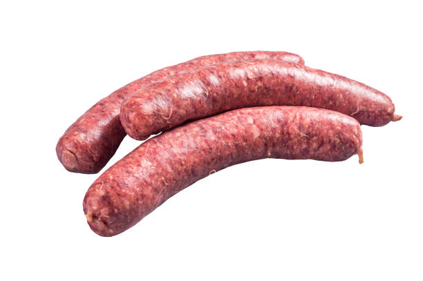 istock Raw beef meat sausages ready for cooking.  Isolated on white background 1474337327
