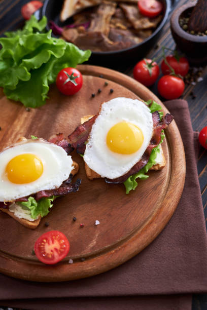 istock French toasts with fried eggs, cream cheese, salad and bacon 1474340618