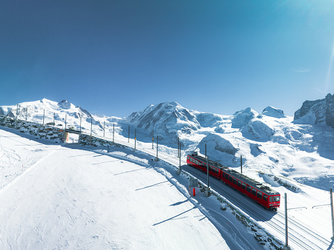 Zermatt, Switzerland -The train of Gonergratbahn running to the Gornergrat station and observatory  in the famous touristic place with clear view to Matterhorn.