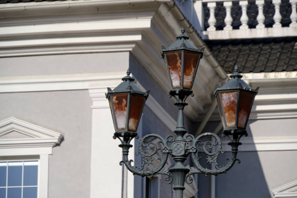 istock Old retro street lamp background historic building. 1474340878