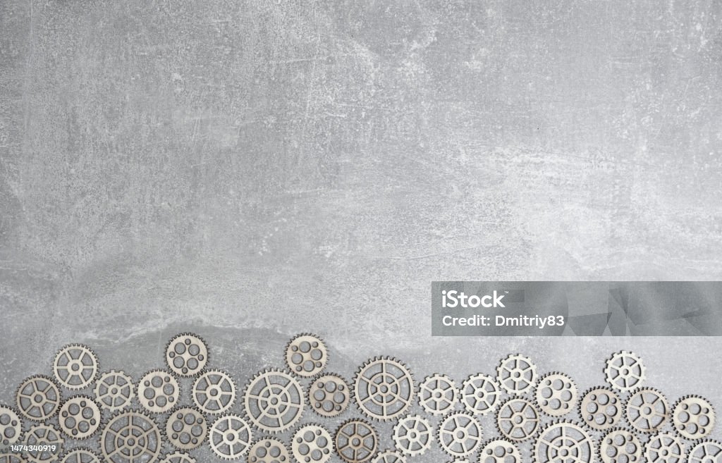 Gray concrete background with gears and copy space. Gray concrete background with gears and copy space Gear - Mechanism Stock Photo