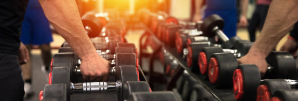 Rows of dumbbells in the gym stock photo