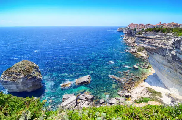 Houses of Bonifacio atop steep cliffs above the Mediterranean sea, Corsica, France