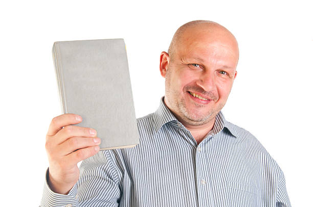 istock Businessman holding a book. 147434616